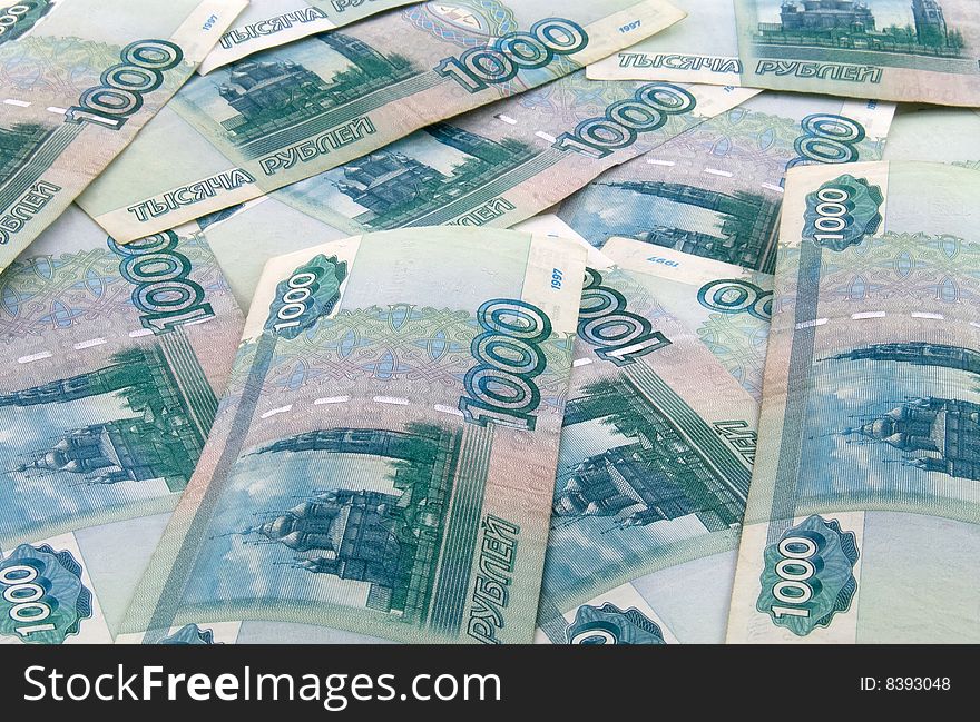 Russian one thousand roubles bills scattered as background