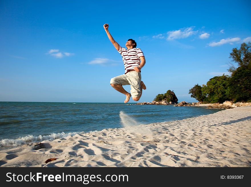 Excited young man having fun at beach. Excited young man having fun at beach