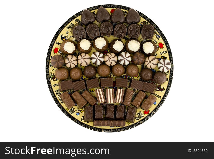 Chocolate sweets on dish,isolated