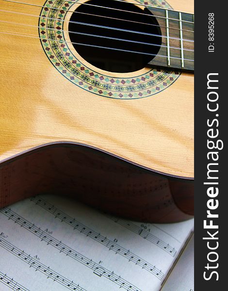 Fragment of Spanish guitar and noted of a song. Fragment of Spanish guitar and noted of a song