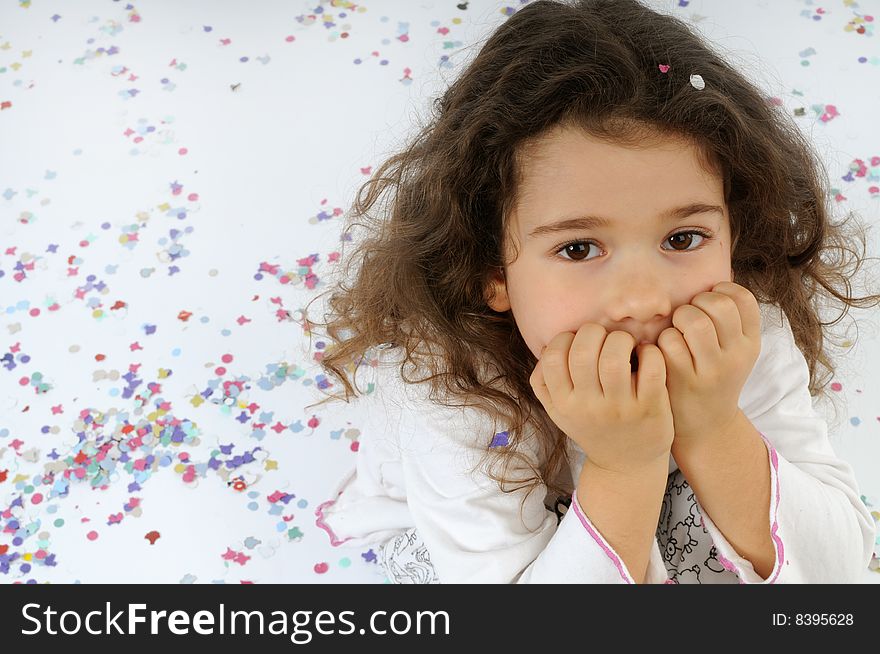 A child play with carnival confetti. A child play with carnival confetti