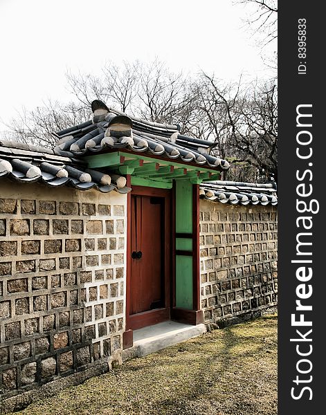 Buddhist Temple Gate against wooded background