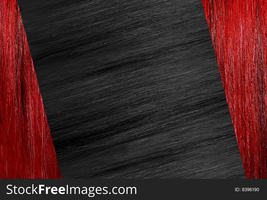 Black brilliant hair on the background red hair