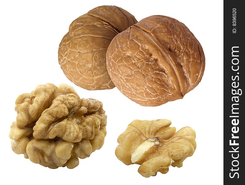 Whole and hulled walnuts isolated over white background