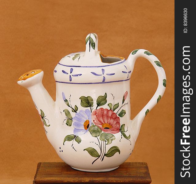 Watering decorative pottery, decorated with a painting of flowers. Watering decorative pottery, decorated with a painting of flowers