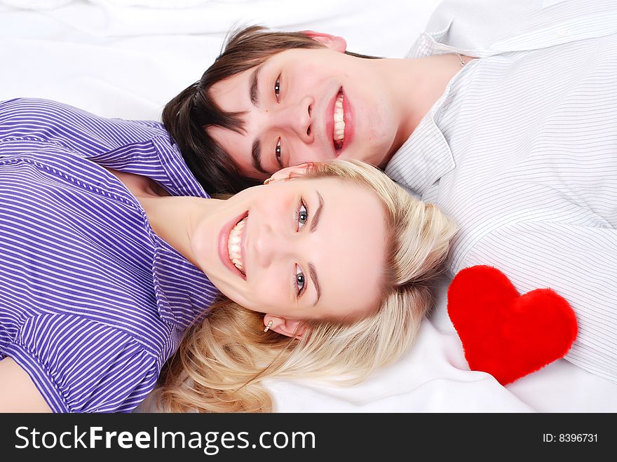 Young loving couple isolated at white background