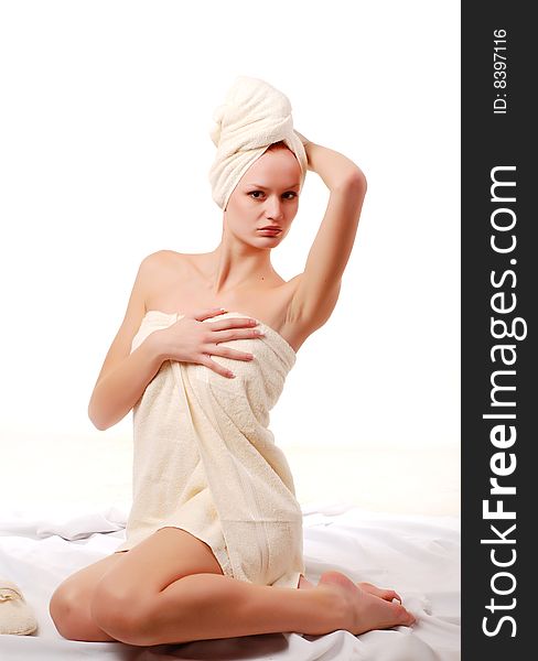 Portrait of beautiful woman in white towels