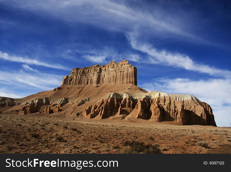 View of the red rock formations in San Rafael Swell with blue skyï¿½s and clouds