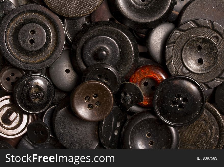 Old  black buttons from a grandmother's stocking. Old  black buttons from a grandmother's stocking.