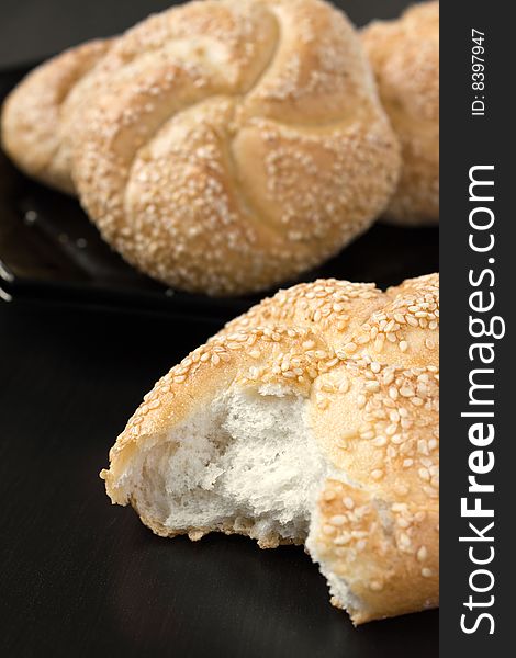 White bread with sesame on black background