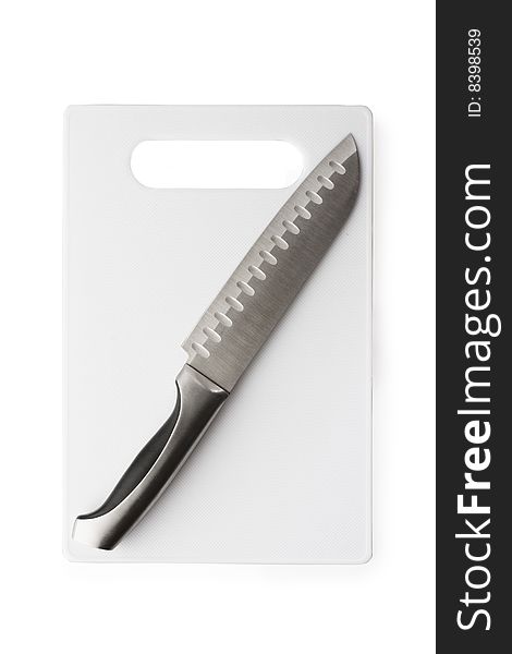 Kitchen knife and the chopping board isolated on white background