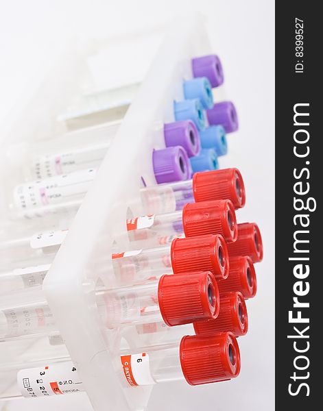 Multi-coloured test tubes isolated on the white