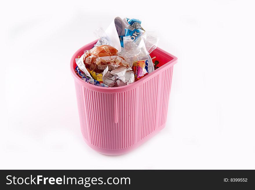 Full pink recycle bin isolated on white