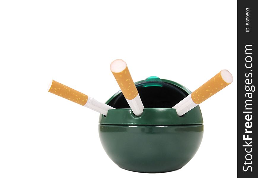 Three unlit cigarettes in an open lid ashtray. Three unlit cigarettes in an open lid ashtray.