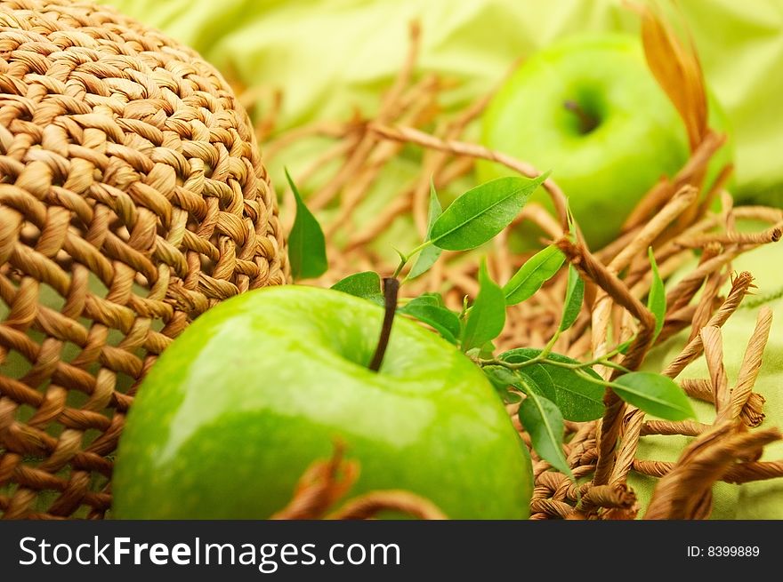 Green apple and straw hat