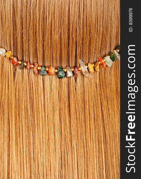 Background from red hair with jewelry. Background from red hair with jewelry