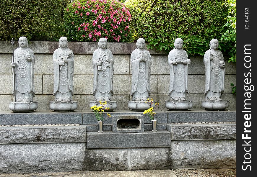 Six stone buddhas on a little altar