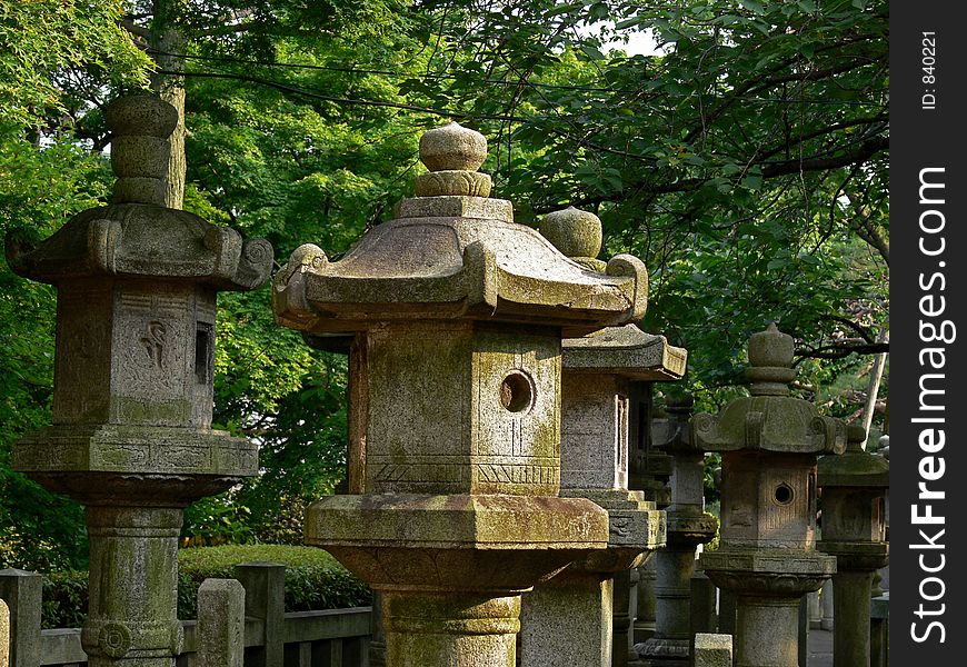 Stone lanterns on a graveyard in Tokyo