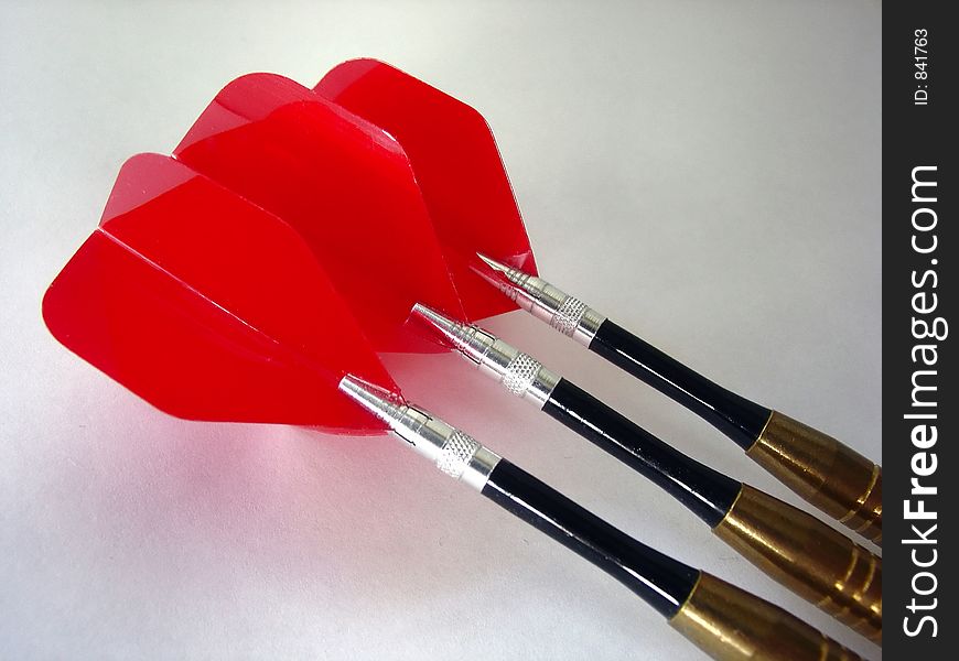 3 darts with red fins