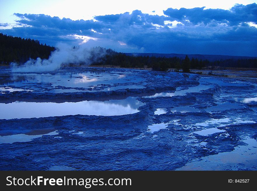 Great Fountain Geyser in Yellowstone National Park at Sunset (in a beautiful blue hue)