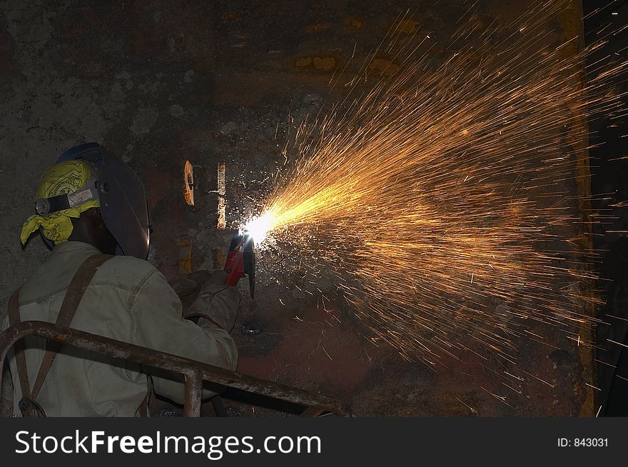 Arc welder working out of manlift. Arc welder working out of manlift