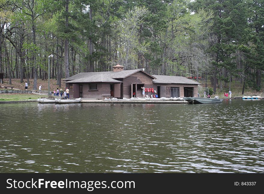 Commercial boat house by the lake with people