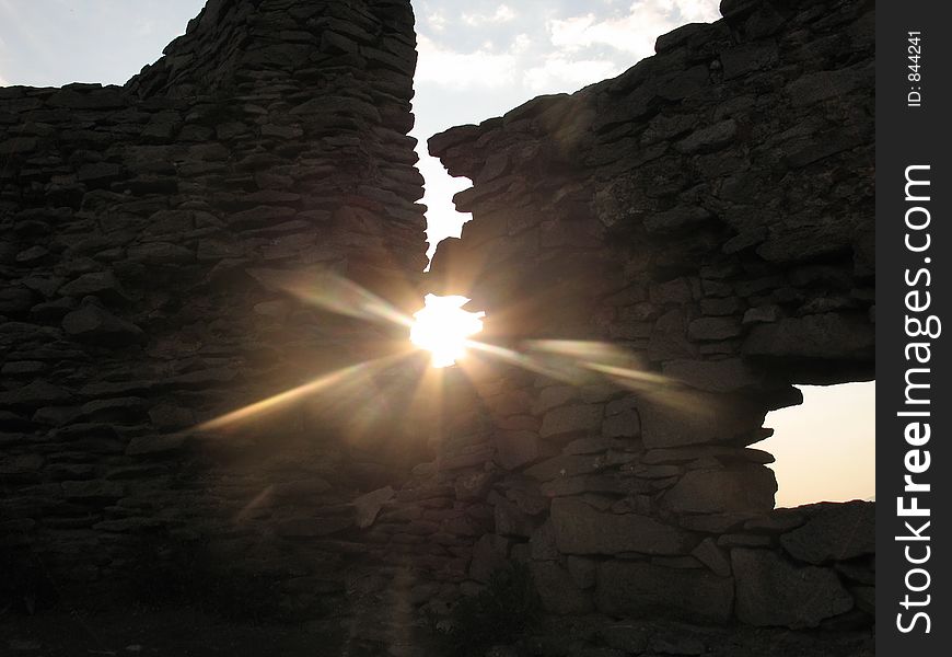 Sun shining through a small hole. Sun shining through a small hole.