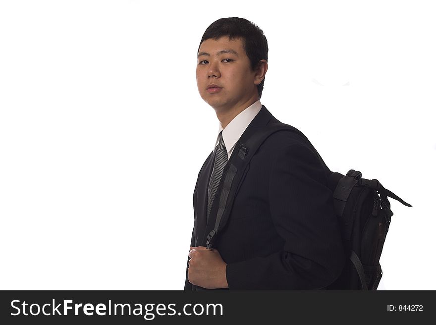 Young asian businessman wearing a backpack, isolated. Young asian businessman wearing a backpack, isolated