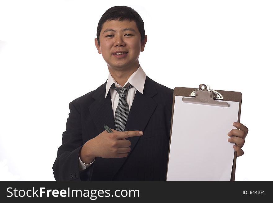 Asian businessman pointing to blank clipboard and smiling. Asian businessman pointing to blank clipboard and smiling