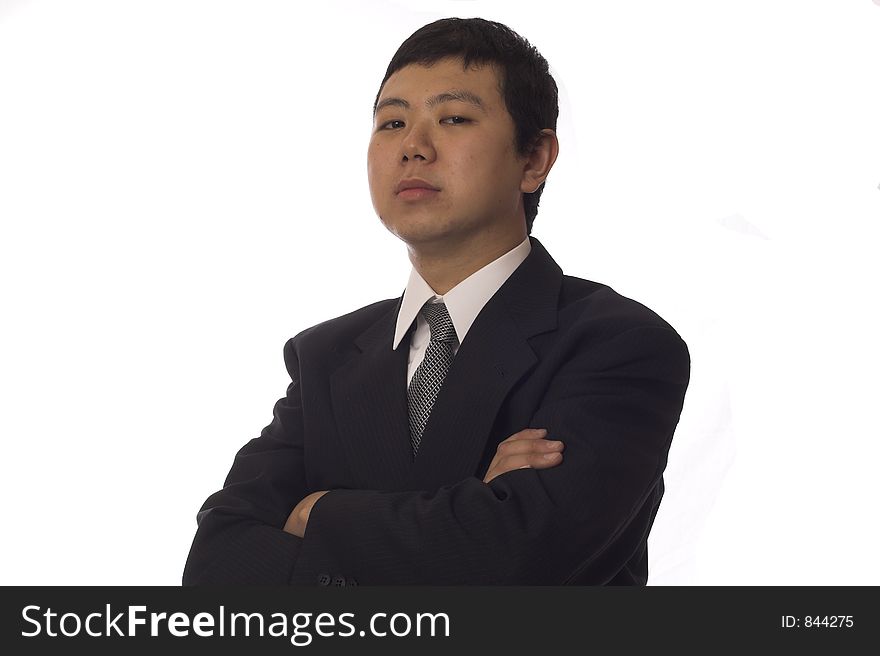 Young asian businessman looking at camera with serious face. Young asian businessman looking at camera with serious face