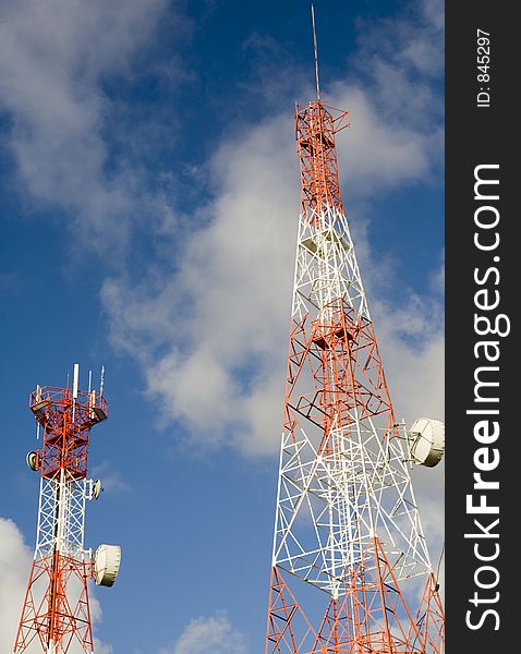 Telecommunication towers against blue sky