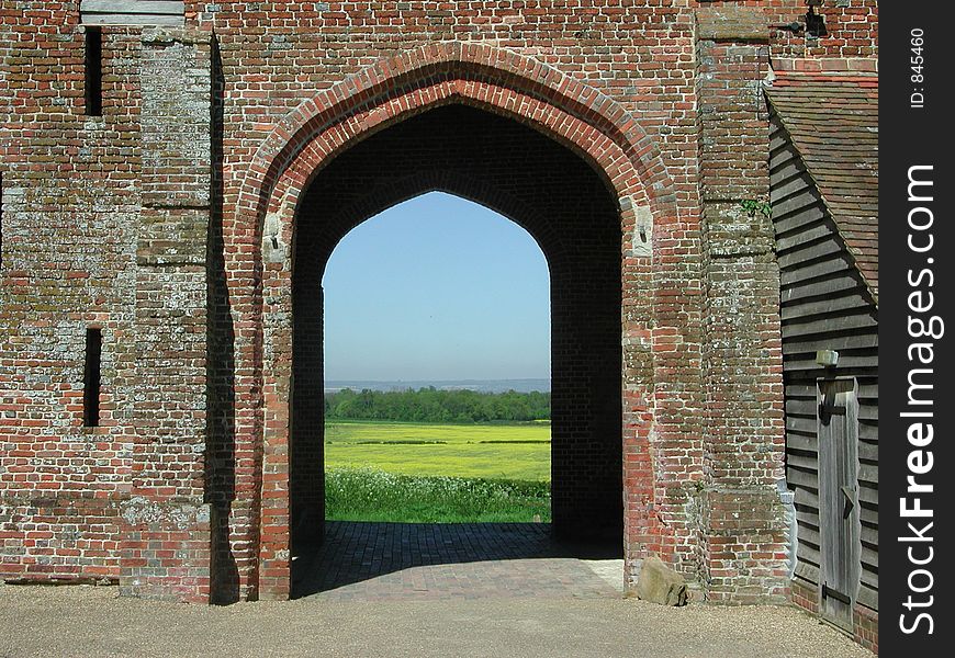 Close up of Old Archway with a view to fields beyond