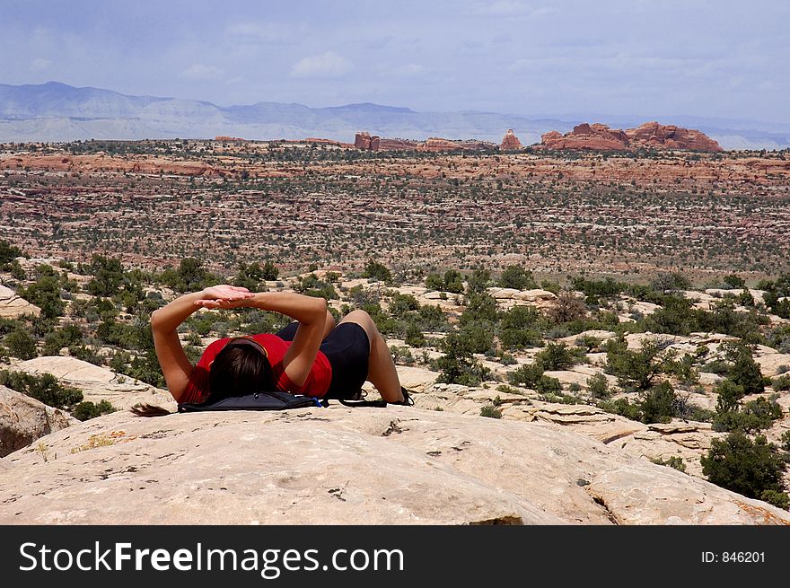 Woman resting during a hike in Arches National Park, UT. Woman resting during a hike in Arches National Park, UT