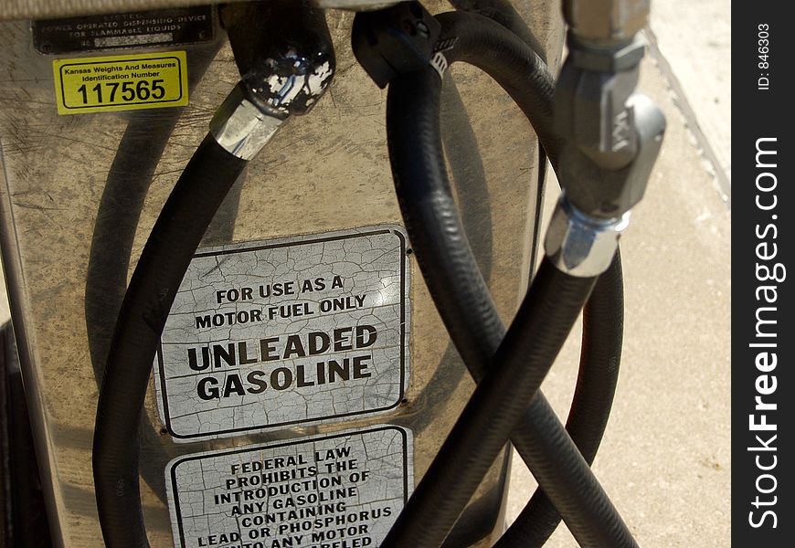 Gas pump with unleaded gasoline label