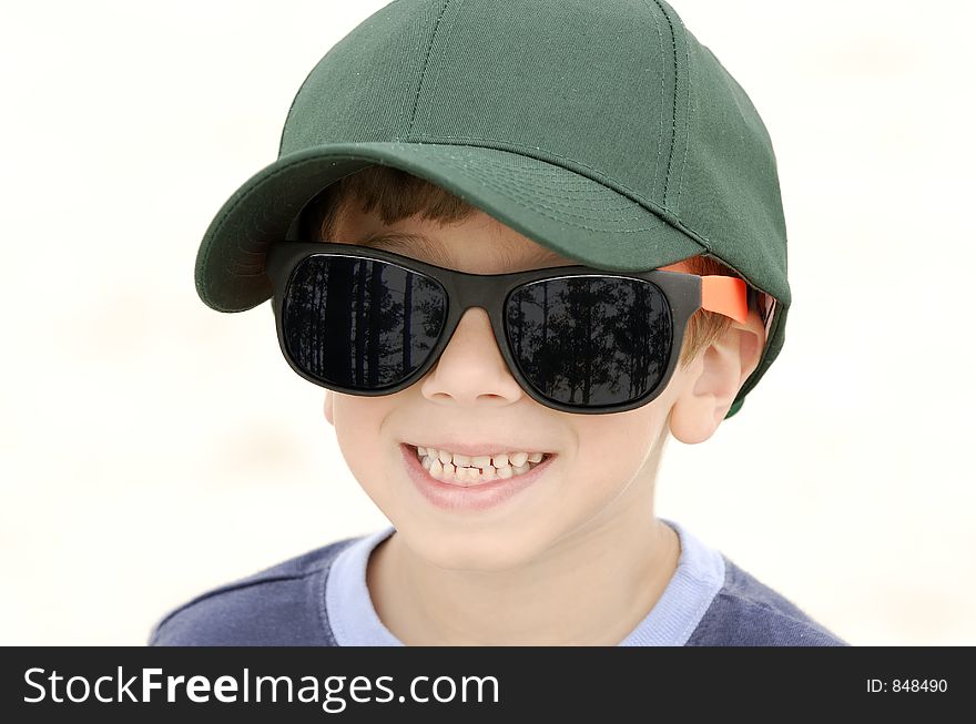 Young Boy Wearing Hat and Glasses. Young Boy Wearing Hat and Glasses