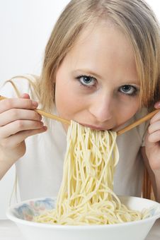Blond Woman Use Chopsticks Eating Noodles Royalty Free Stock Photos Blond Woman Use Chopsticks Eating Noodles Royalty Free Stock Photos
