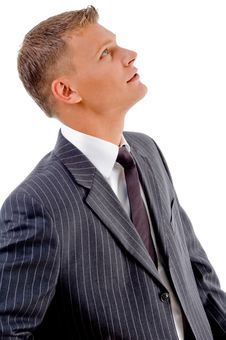 Side Pose Of Young Businessman Looking Upward Stock Photo Side Pose Of Young Businessman Looking Upward Stock Photo