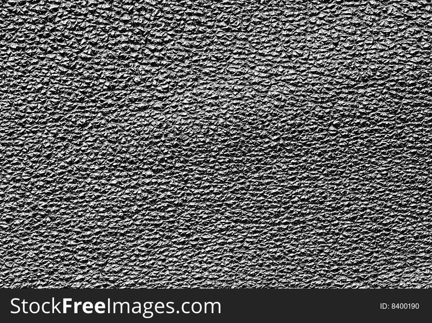 A close-up of the texture of black leather. A close-up of the texture of black leather