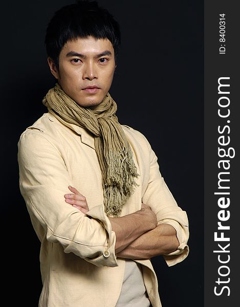 Studio picture of a young man dressed for winter on black background. Studio picture of a young man dressed for winter on black background
