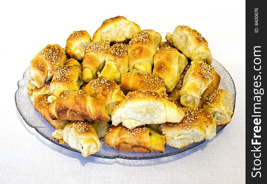 Lot of salty croissants with cheese and sesame.