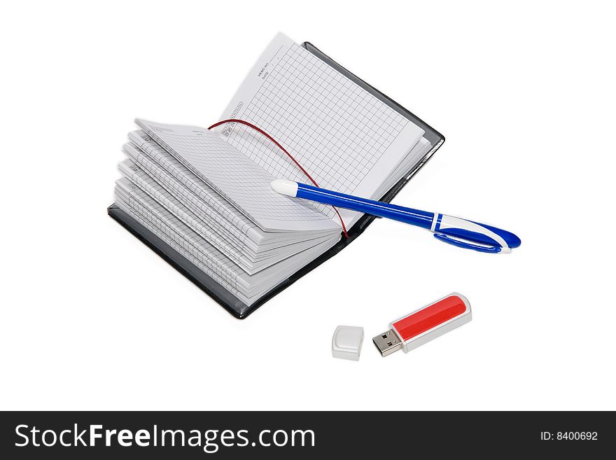 Notebook, pen and USB flash drive isolated on the white background