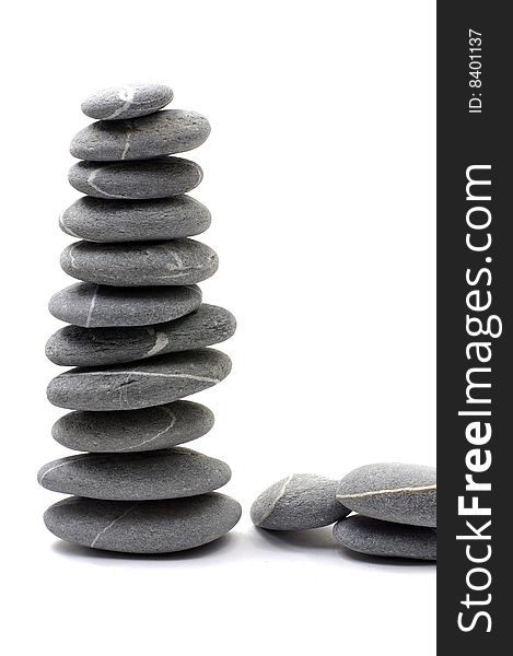 Stack of smooth pebbles over white background. Stack of smooth pebbles over white background