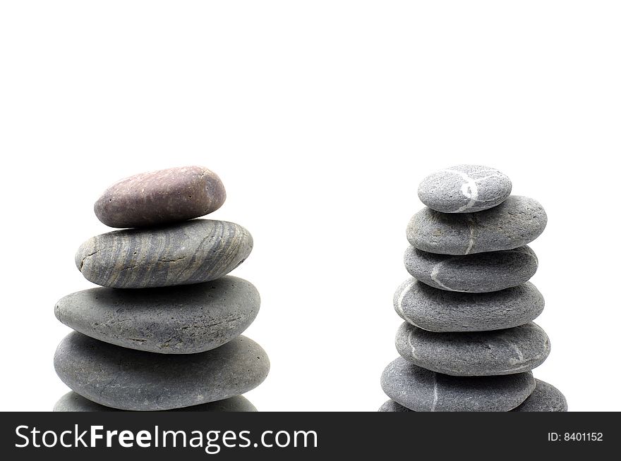 Stack of smooth pebbles over white background. Stack of smooth pebbles over white background