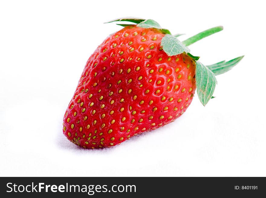 A single fresh strawberry isolated on white background