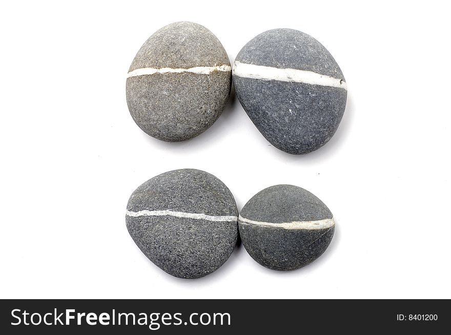 Stack of smooth pebbles over white background. Stack of smooth pebbles over white background