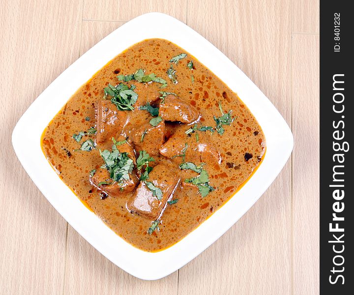 Tasty and fresh butter chicken in white plate. Tasty and fresh butter chicken in white plate