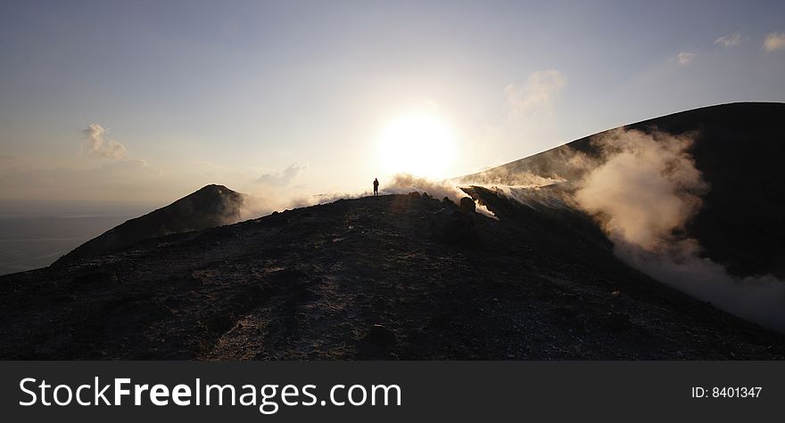 A man in exhalation of Grand Crater, Volcano, Lipari Islands, south Italy. A man in exhalation of Grand Crater, Volcano, Lipari Islands, south Italy