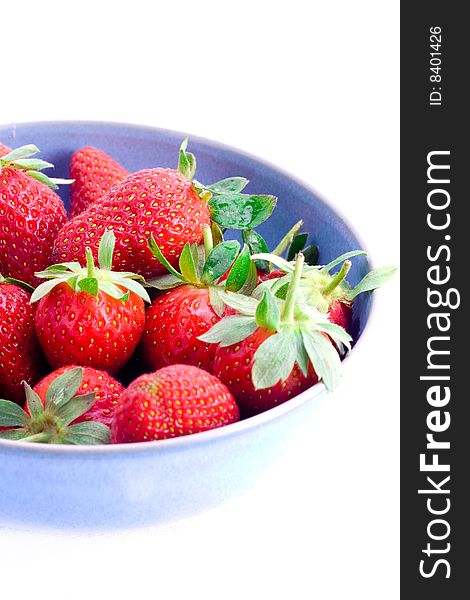 A bowl of fresh strawberries with stems