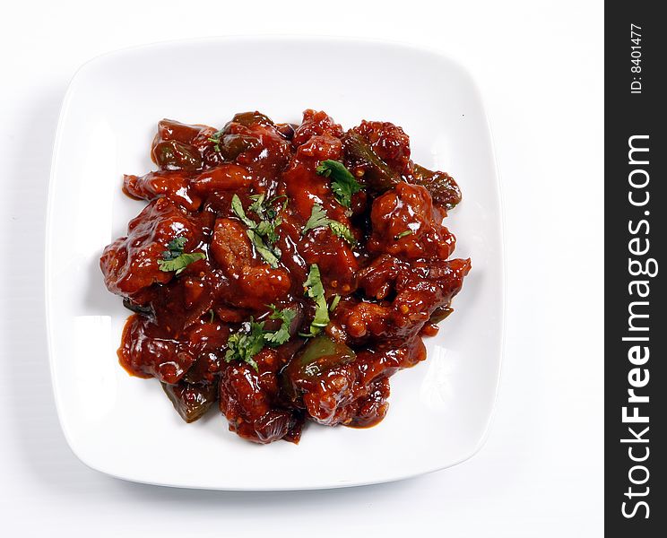 Chilli chicken ready to serve in plate. Chilli chicken ready to serve in plate