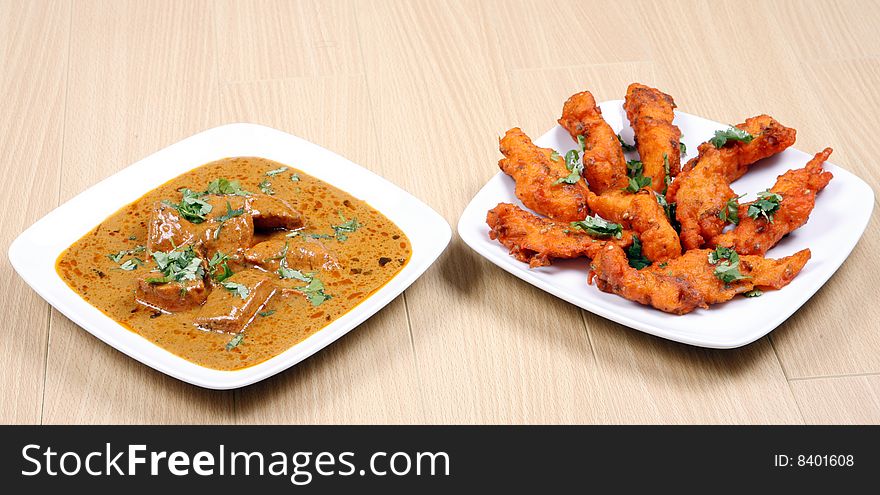 Tasty and spicy fried fish in white plate ready to eat. Tasty and spicy fried fish in white plate ready to eat